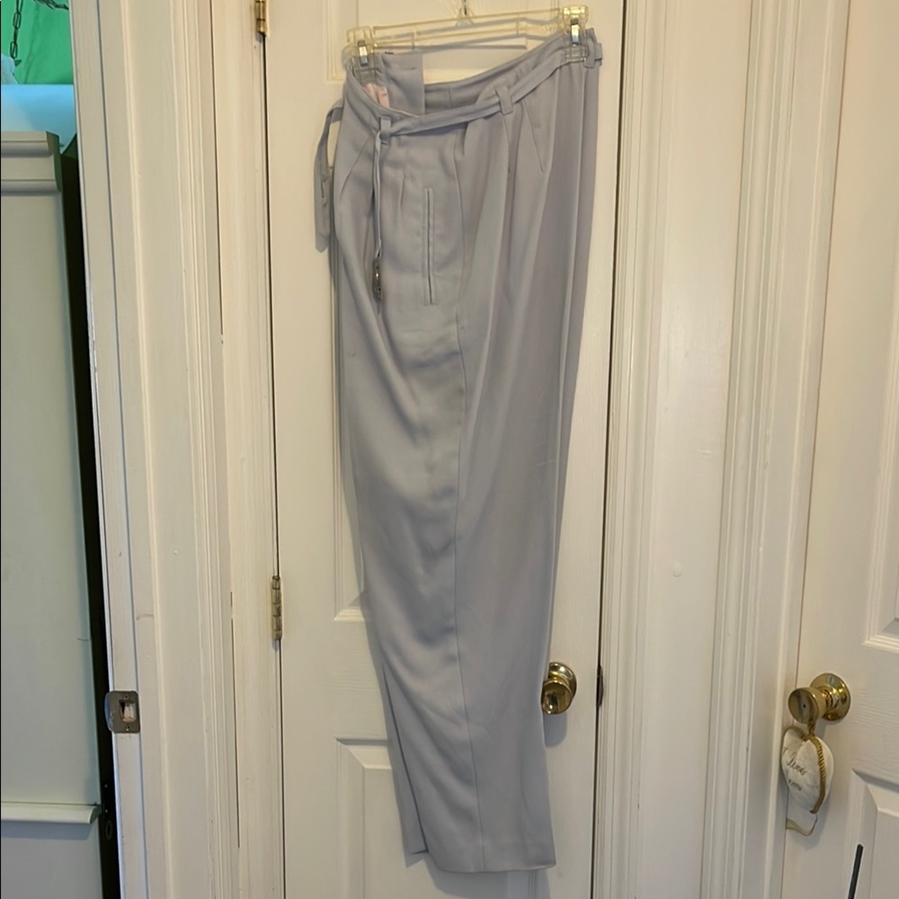 Ladies pant suit in a light lilac. Pants size 16 jacket size 14